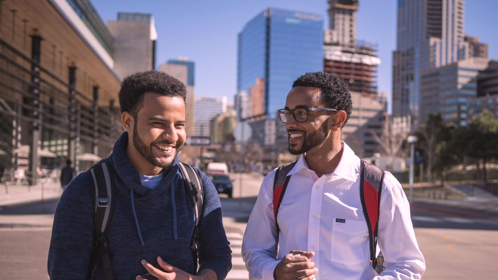 Two male students walking through CU Denver campus