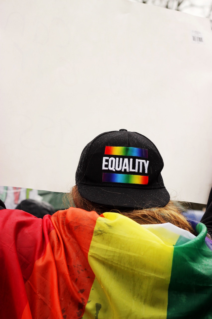 Hat with equality written on the back with a rainbow banner