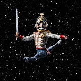 Nutcracker ballet dancer mid-jump in Nutcracker costume, black starry sky background