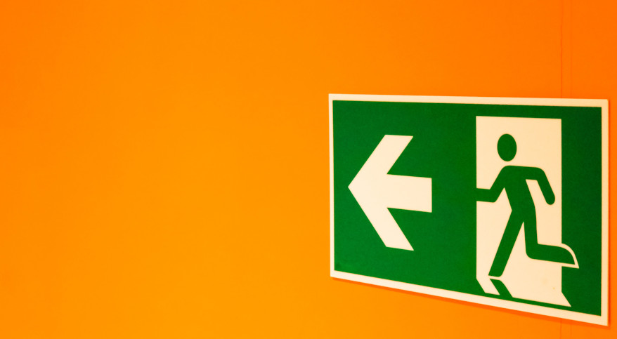 green exit sign on orange background