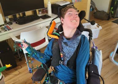 Young Man in Wheelchair with Christmas lights