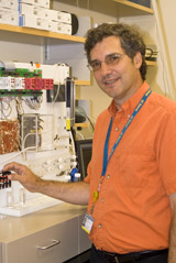 headshot of Diego Restrepo smiling inside of a lab