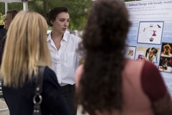 a post doctoral student presents her research poster