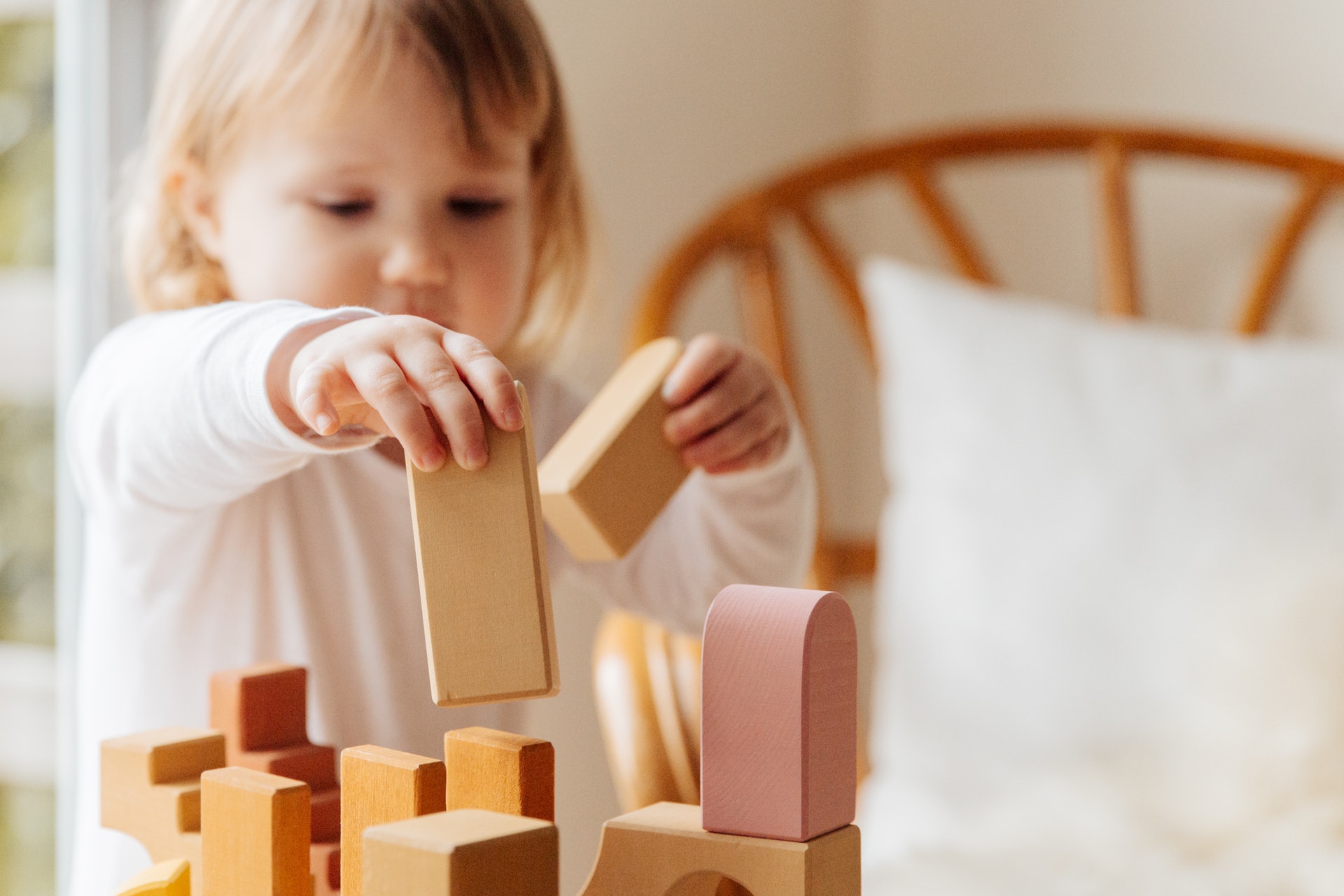 young girl building blocks