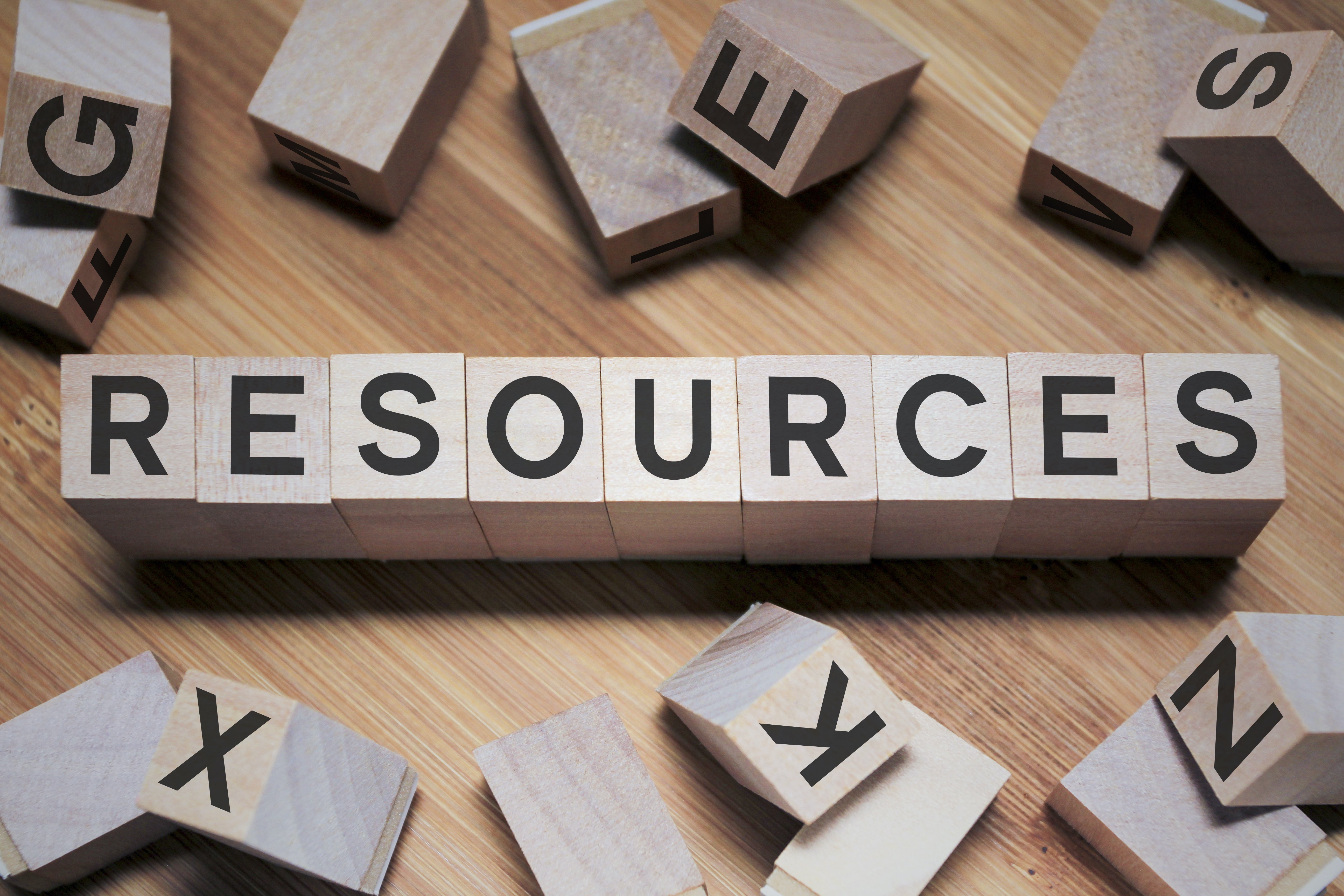 Row of wooden block letters that spell "resources".